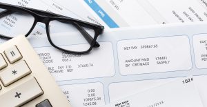 Glasses, pay slips, tax codes
