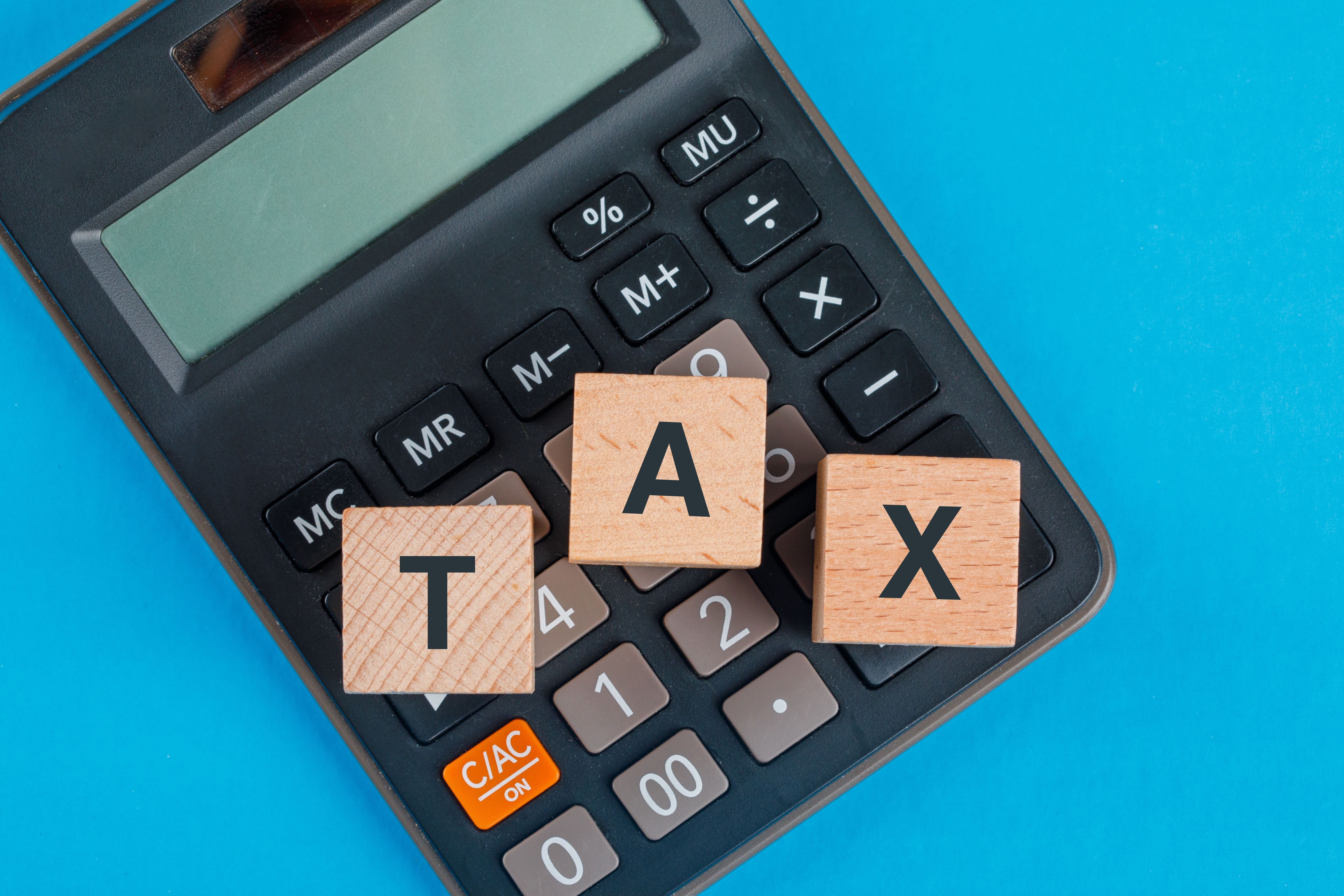 Calculator and letter block spelling tax